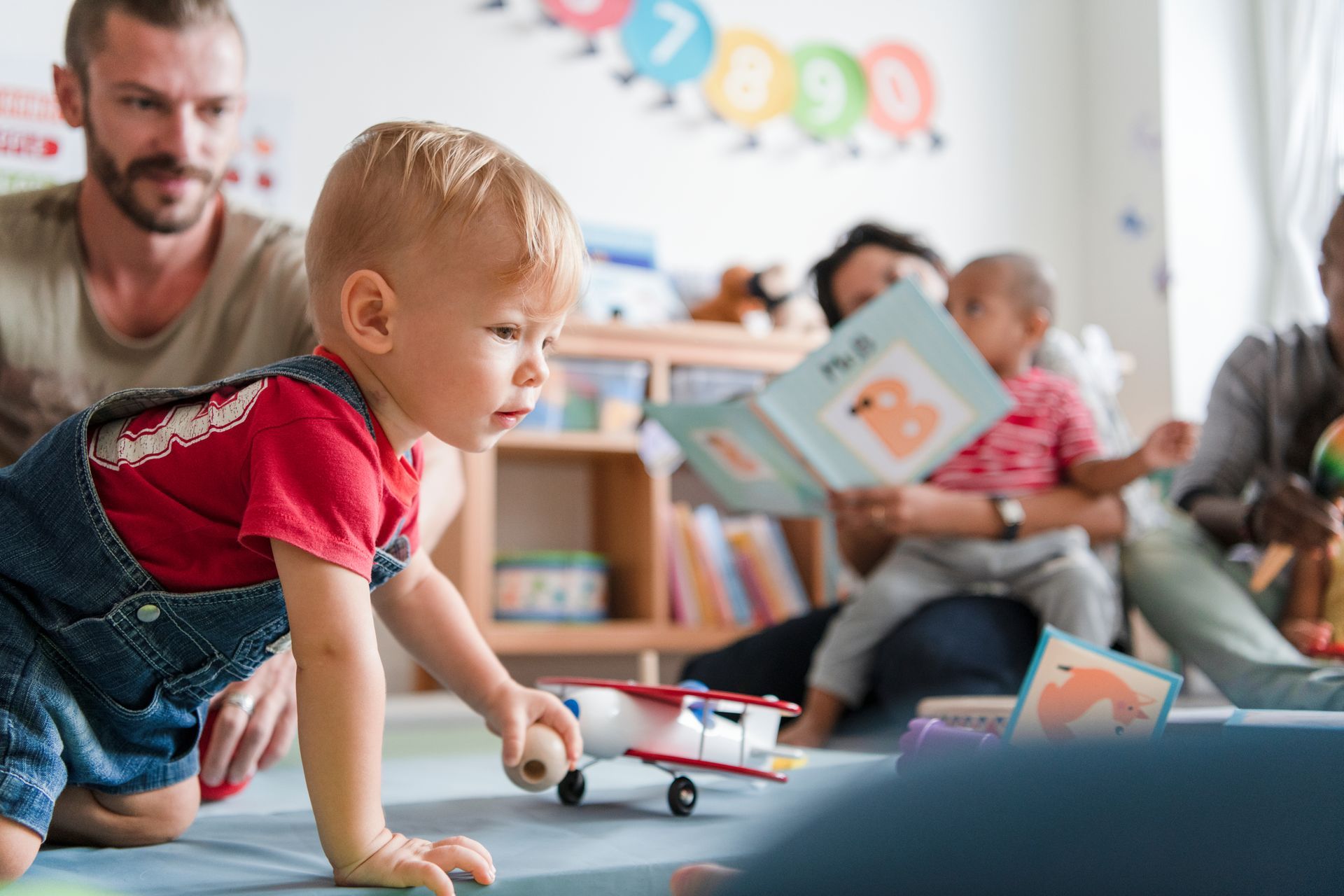 Children and caregivers participating in a Mobile Early Learning activity