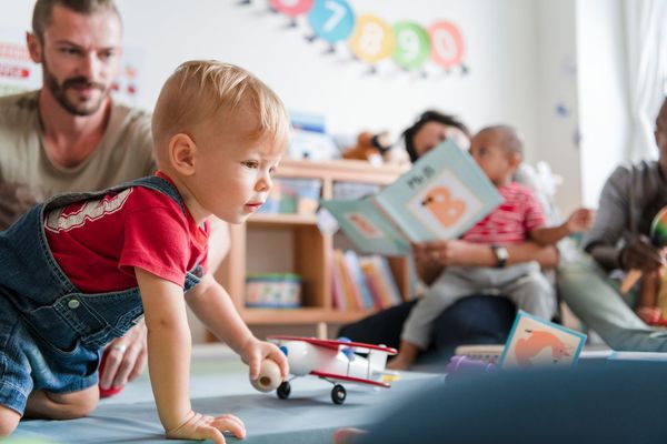 Children and caregivers participating in a Mobile Early Learning activity