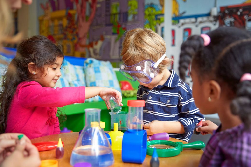 Children and caregivers participating in a Mobile Early Learning activity
