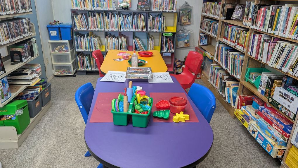 Children and caregivers participating in a Mobile Early Learning activity