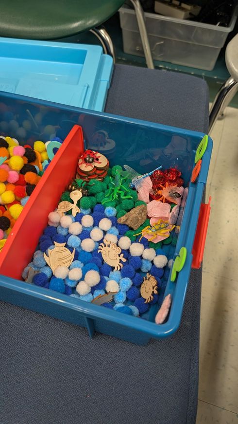 Children and caregivers participating in a Mobile Early Learning activity