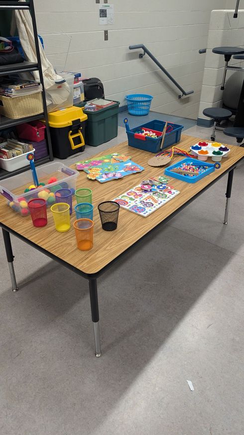Children and caregivers participating in a Mobile Early Learning activity