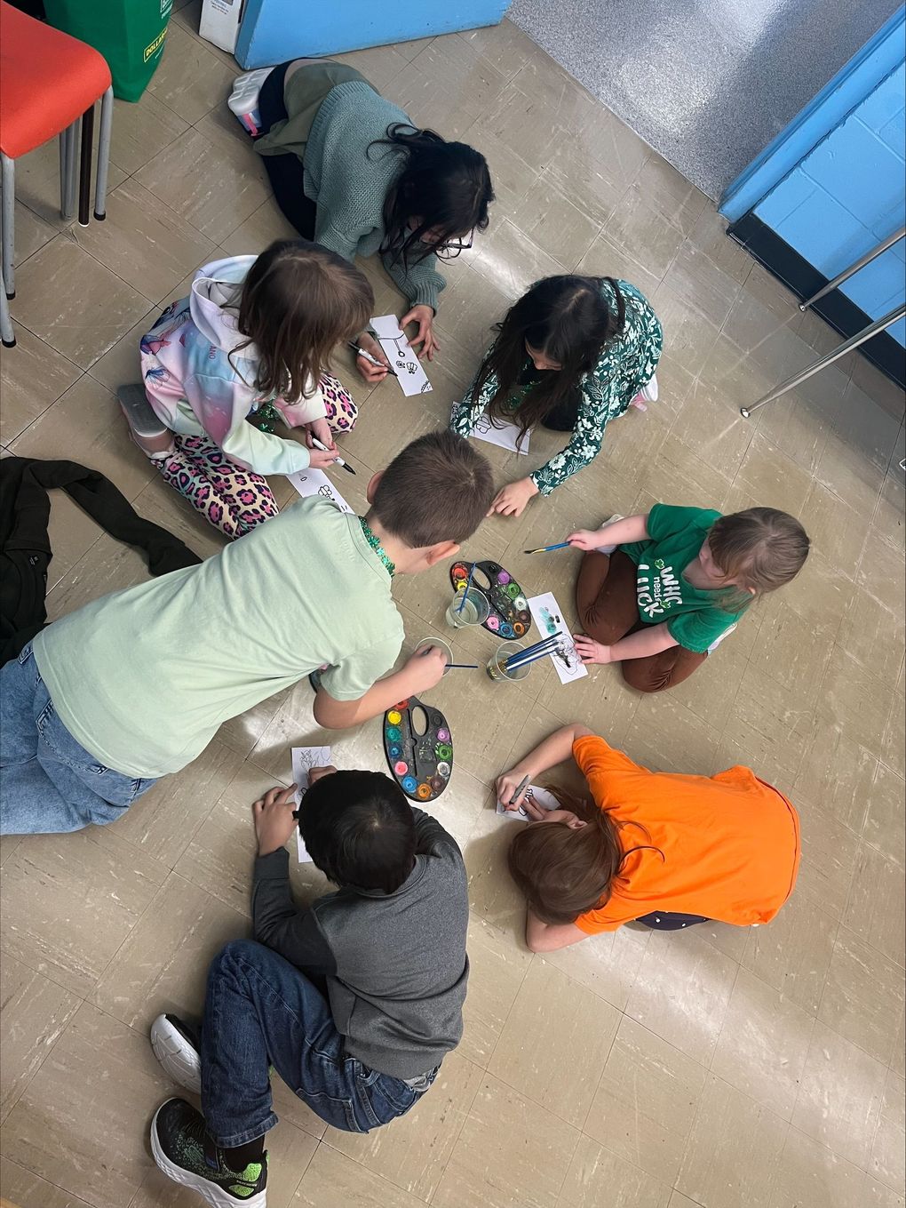 Children and caregivers participating in a Mobile Early Learning activity