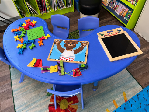 Children and caregivers participating in a Mobile Early Learning activity