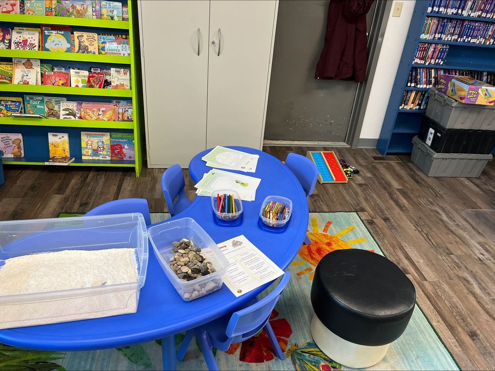 Children and caregivers participating in a Mobile Early Learning activity