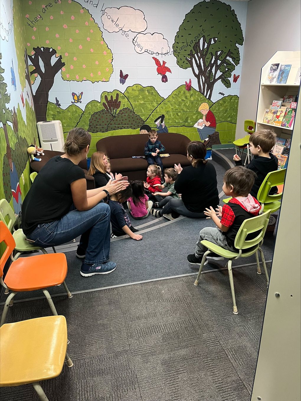 Children and caregivers participating in a Mobile Early Learning activity