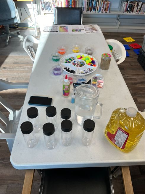Children and caregivers participating in a Mobile Early Learning activity