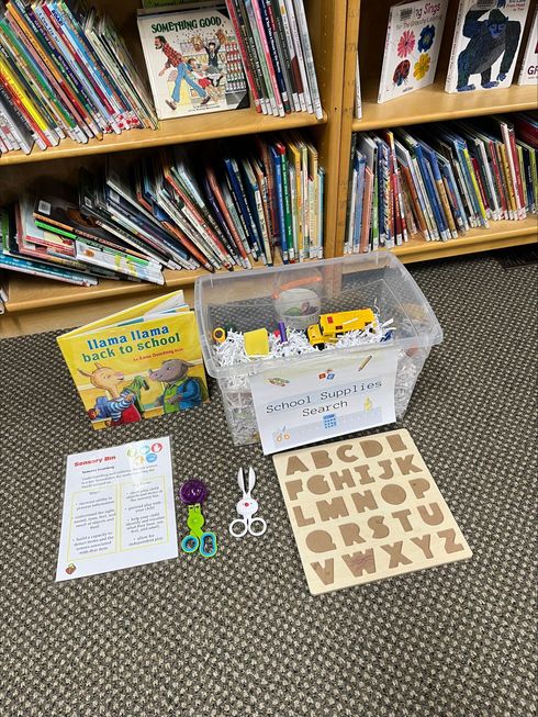 Children and caregivers participating in a Mobile Early Learning activity