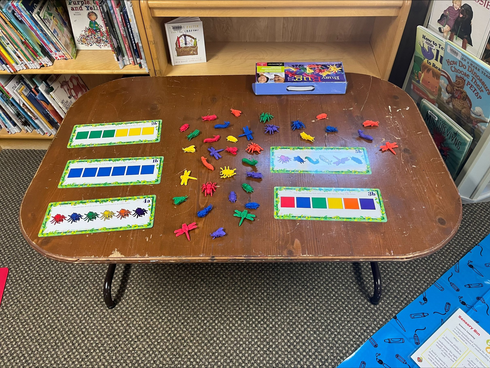 Children and caregivers participating in a Mobile Early Learning activity