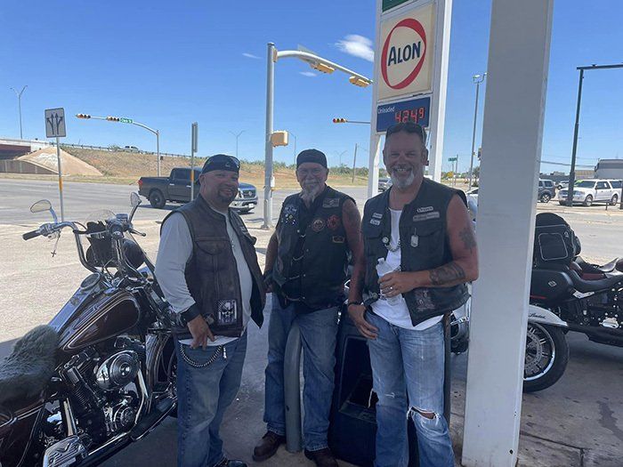 three bikers posing