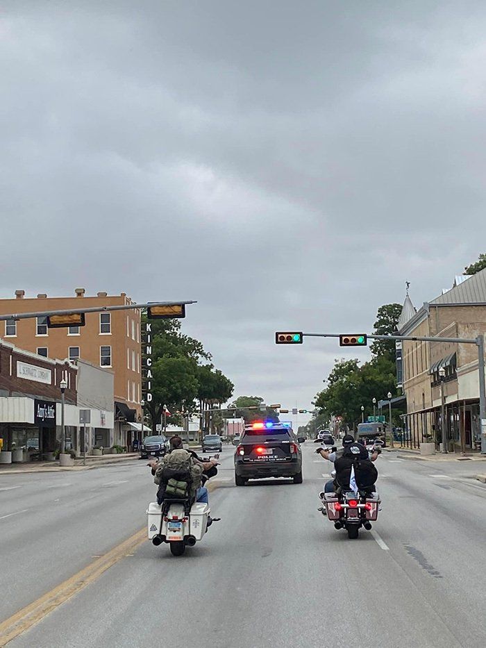 bikers following police vehicle