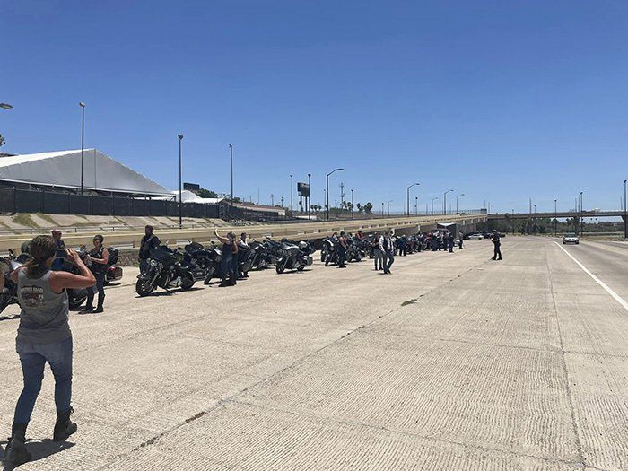 bikers on side of freeway