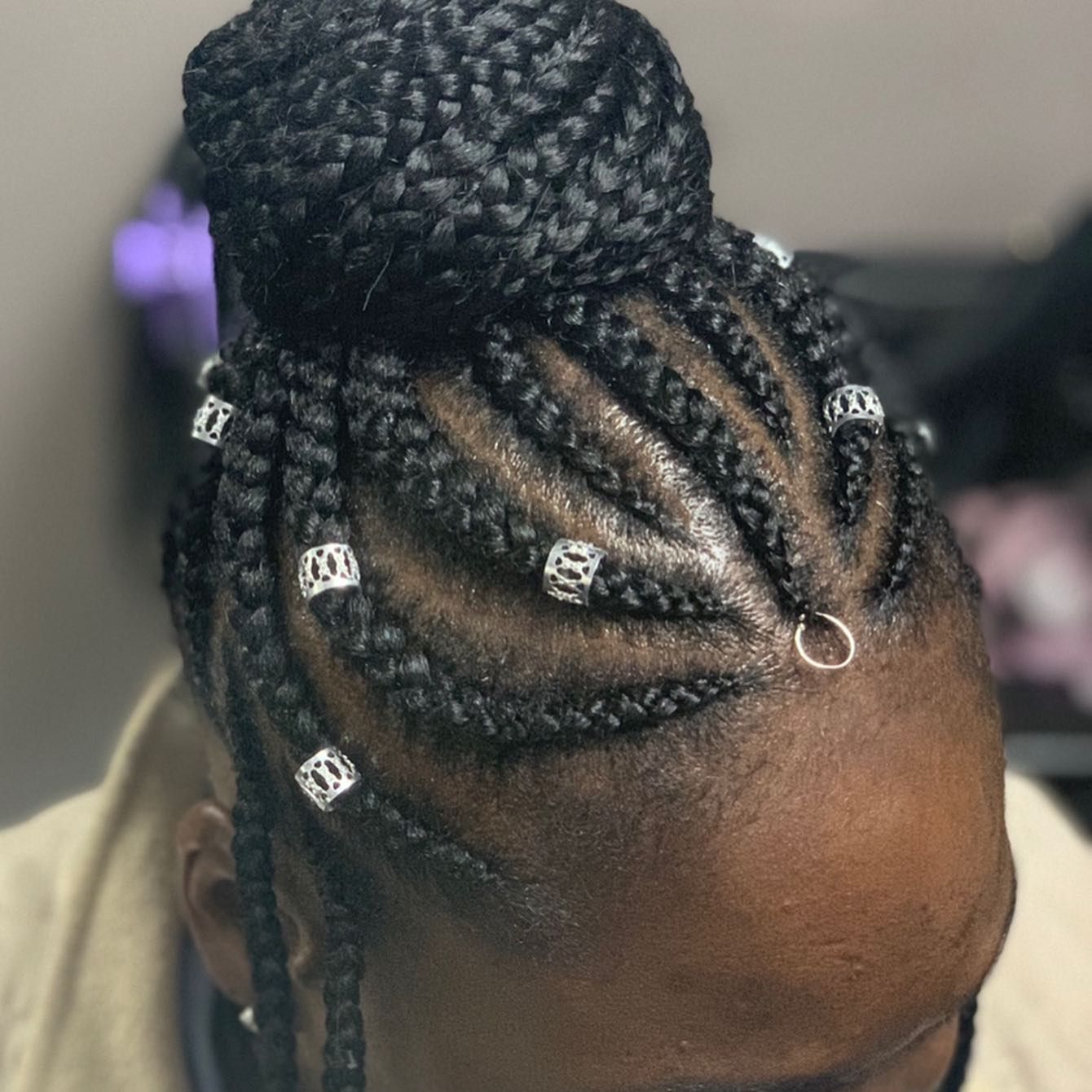 A woman with braids and beads in her hair