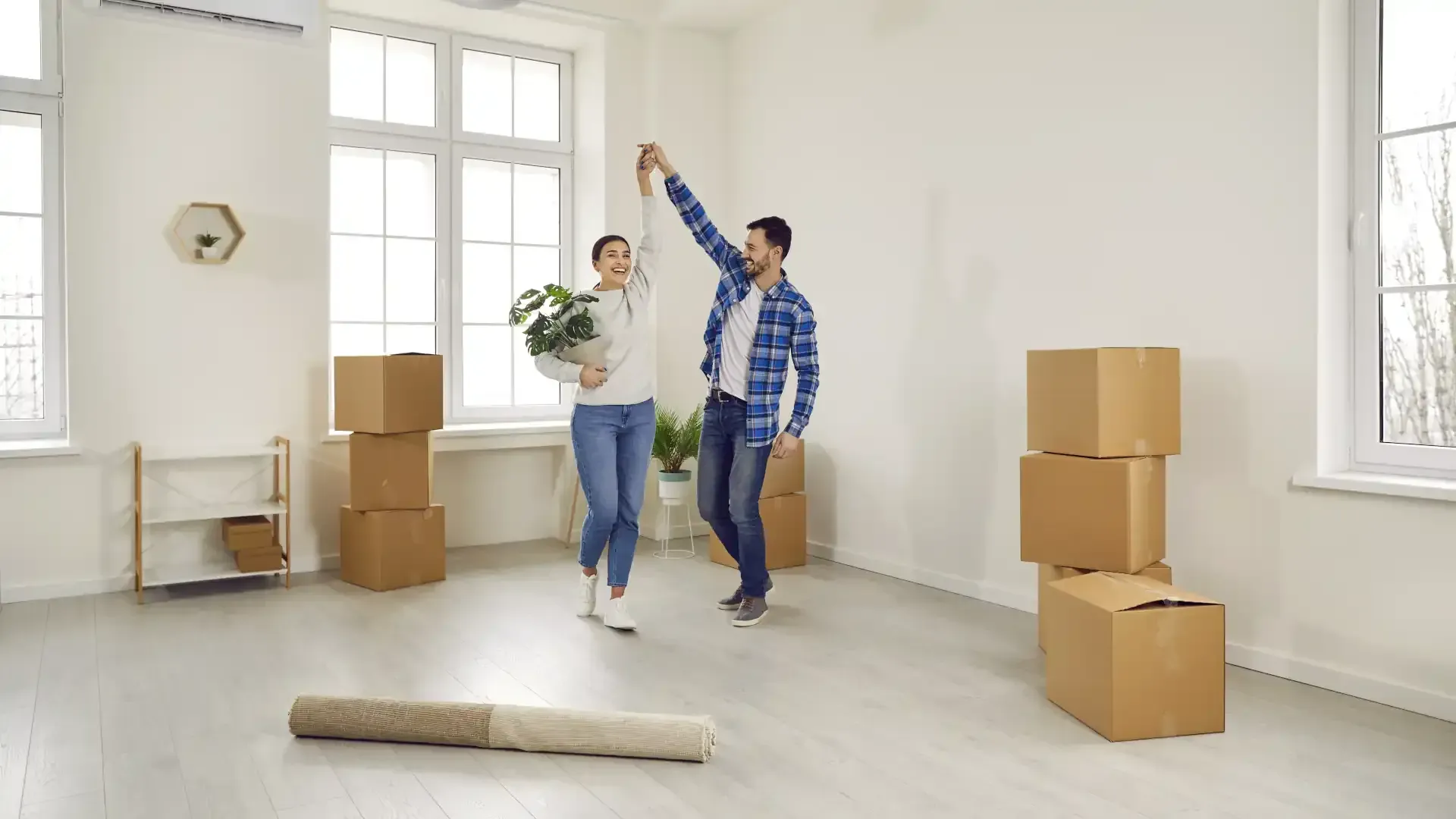 How to find a tenant for your rental – New tenants sitting on the floor surrounded by moving boxes
