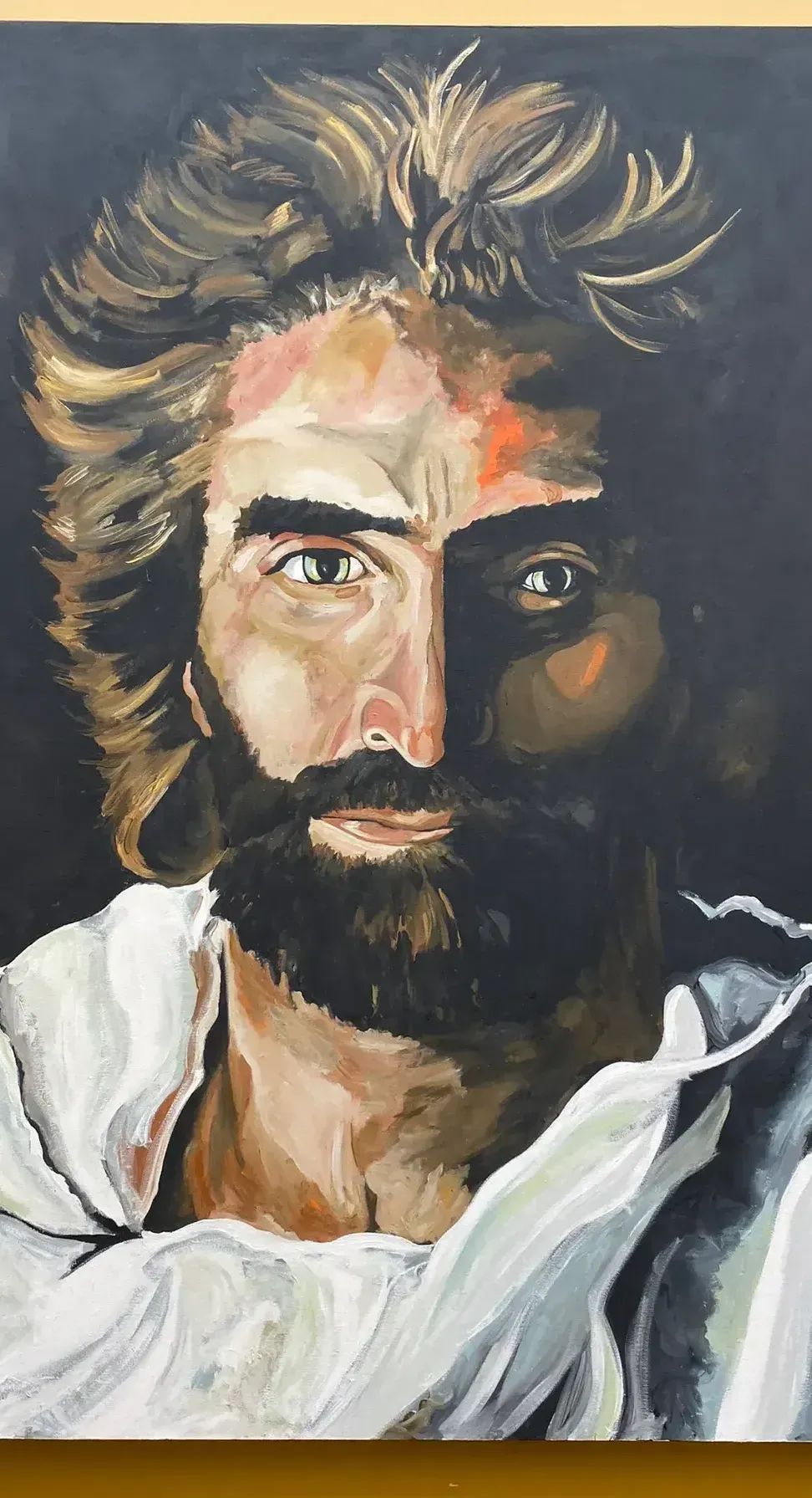 A painting of Jesus Christ with short hair and thick eyebrows, mustache, and beard.