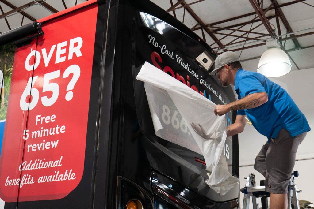 Install of vinyl decals on RV
