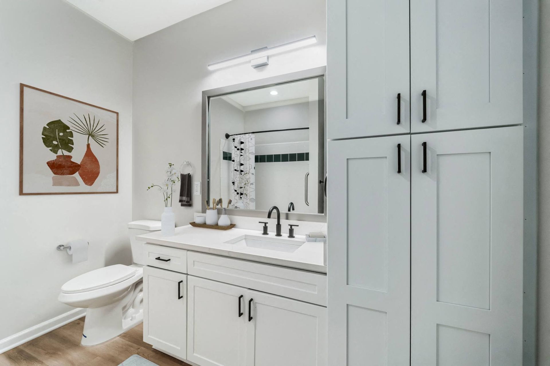 a bathroom with a sink and a toilet and a mirror
