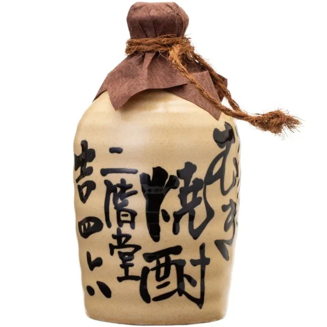 Ceramic sake bottle with brown cloth cap and black Japanese calligraphy on a white background