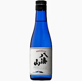 Blue bottle of Japanese sake with a white label and black kanji on a plain background