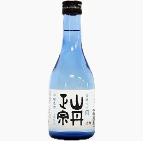 Blue bottle of Japanese sake with a white label and black cap