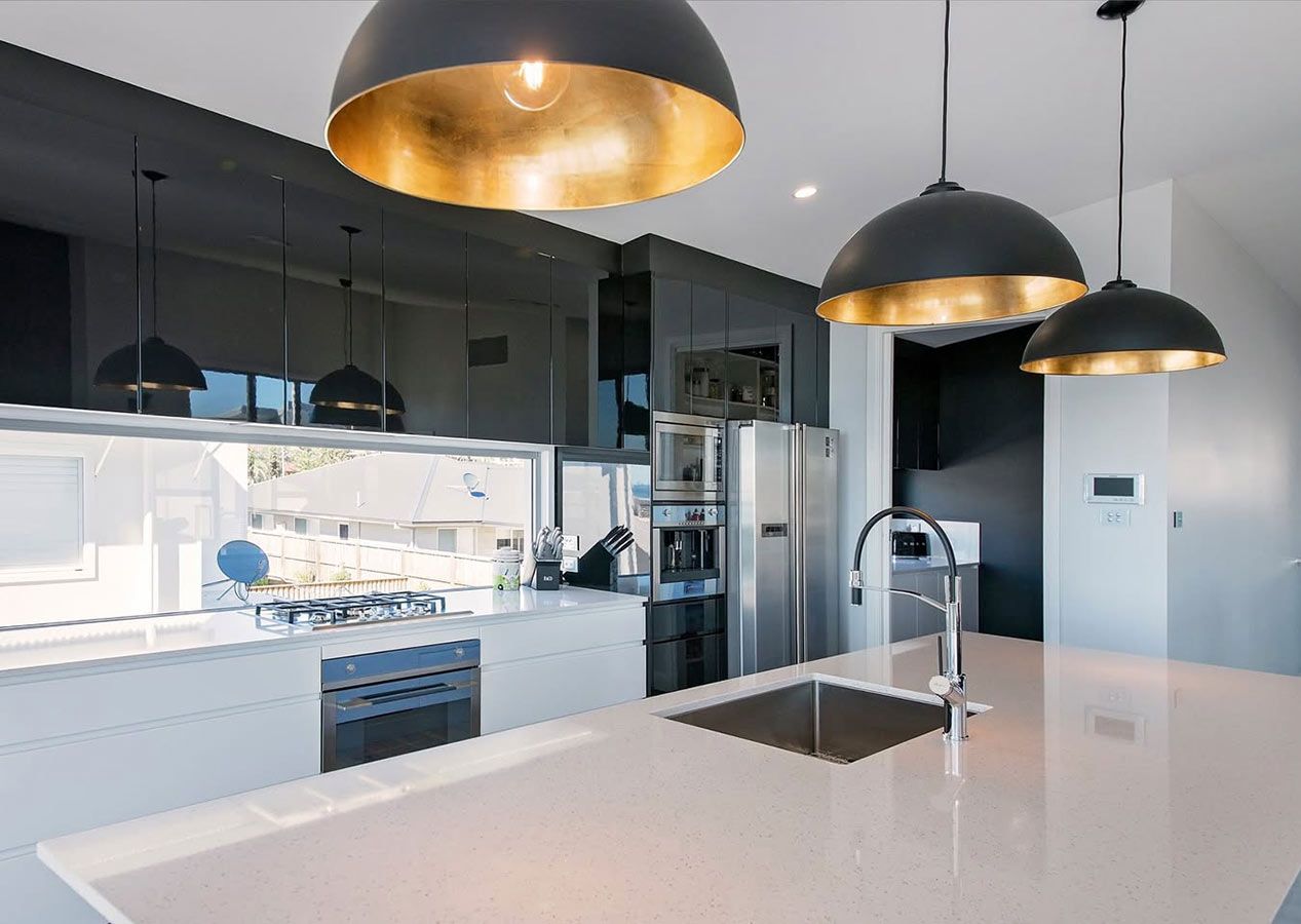 A Kitchen With a Sink, Stove, Refrigerator, Dishwasher and Pendant Lights — Allnew Kitchens in Charmhaven, NSW