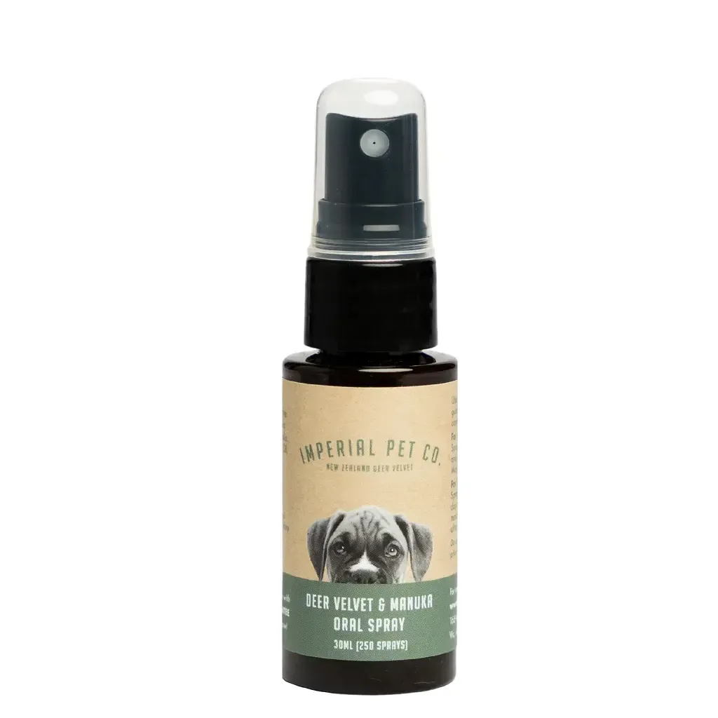 Black spray bottle with clear cap and tan-green label on a white background