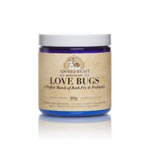 Blue jar labeled “Love Bugs” prebiotic supplement with silver lid on white background