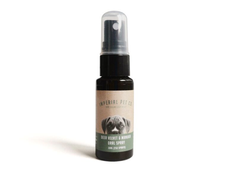 Small black spray bottle with a clear cap and green label on a white background
