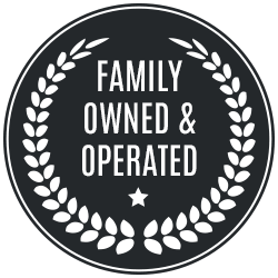 A family owned and operated badge with a laurel wreath around it.