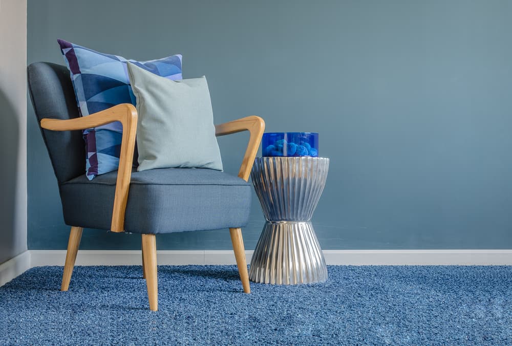 Wooden Chair With Blue Pillow And Carpet - Flooring in Murgon, QLD
