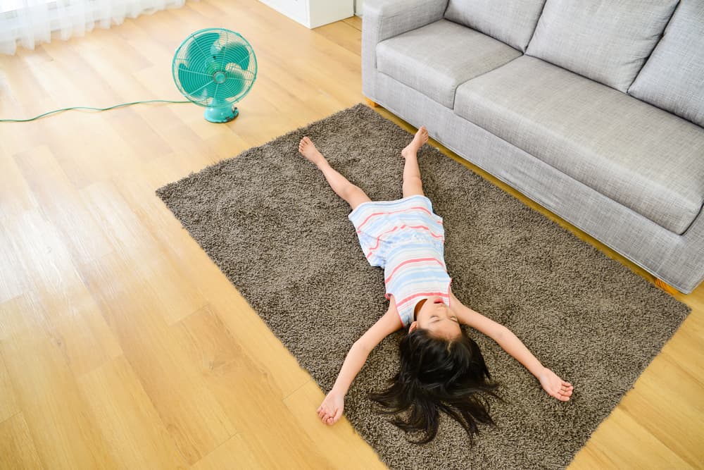 Little Girl Lying Down On carpet - Flooring in Nanango, QLD