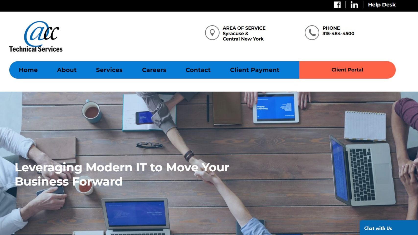 Corporate website homepage with blue navigation and hero banner showing coworkers around a laptop at a desk