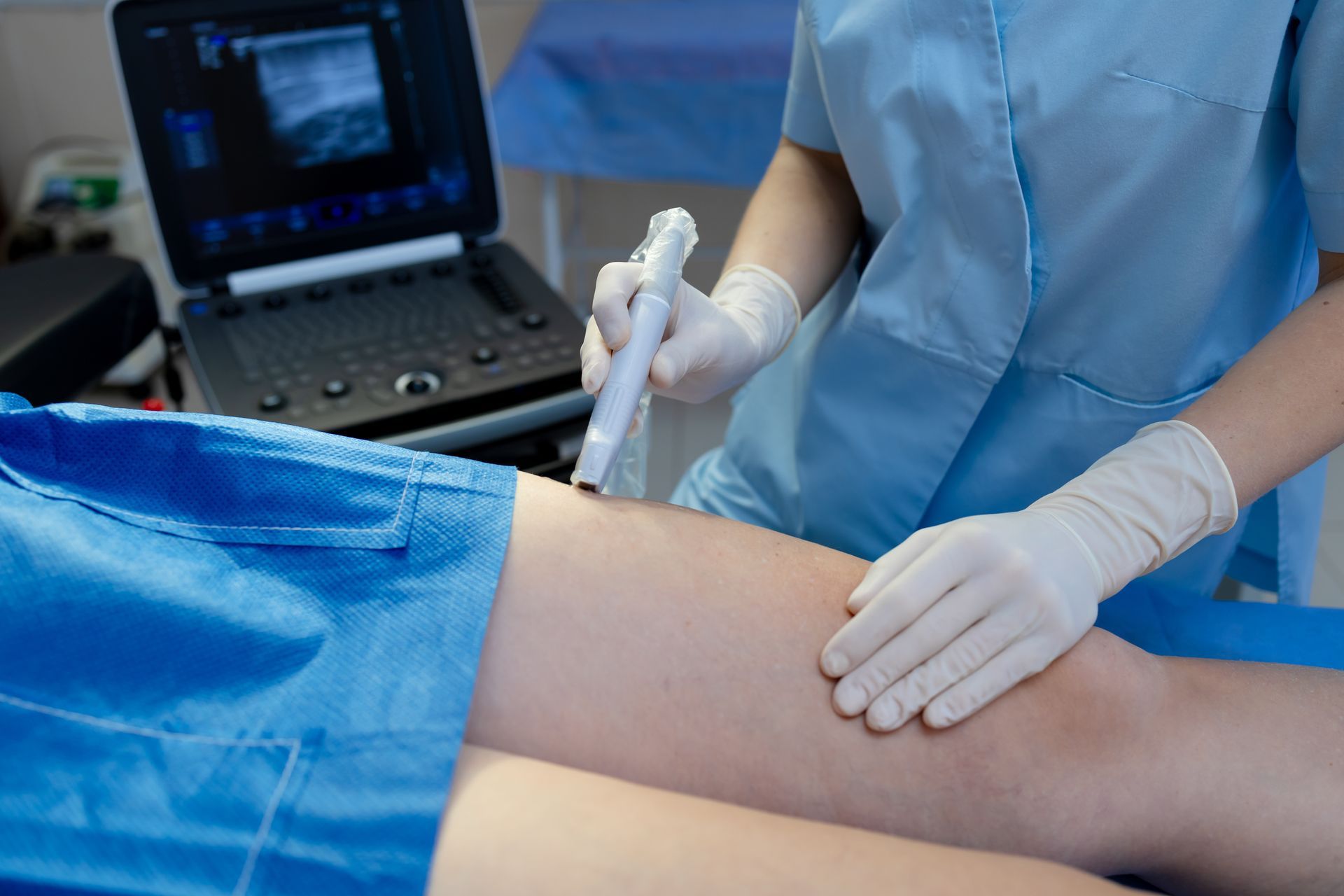 Doctor is adding markings on thighs