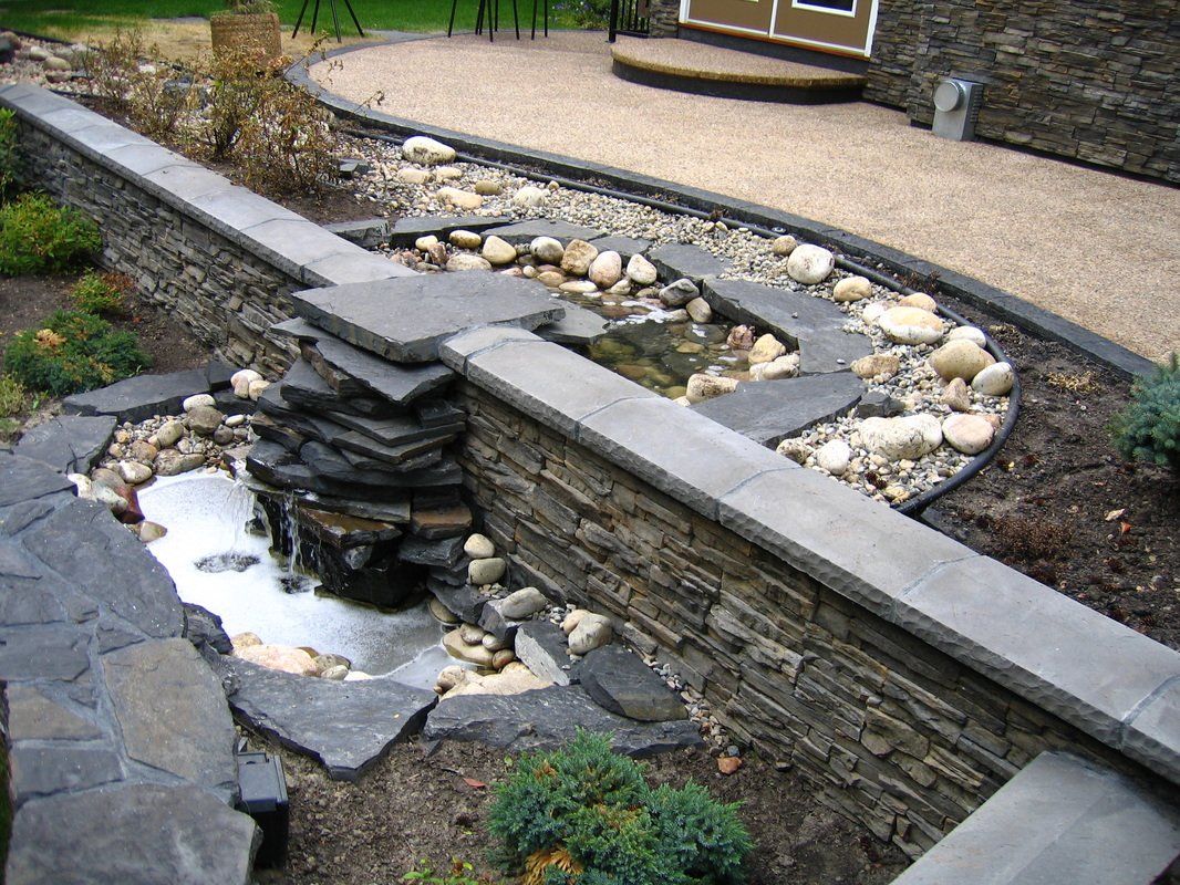 Outdoor lawn drainage system with pond and garden walls