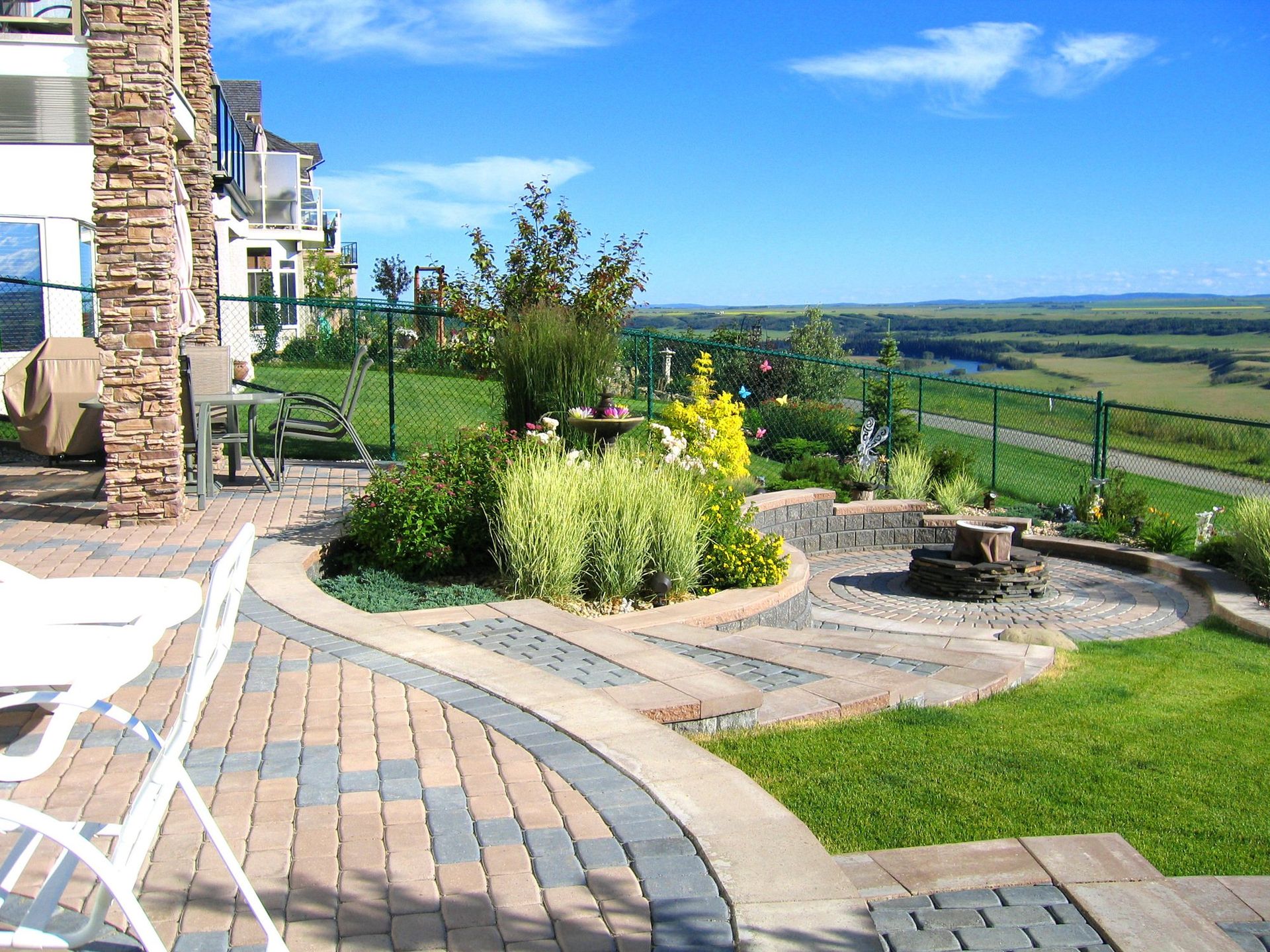 paved patio construction with backyard landscape design