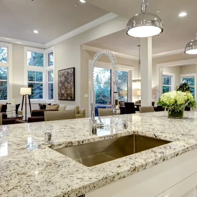 A kitchen with granite counter tops and a sink