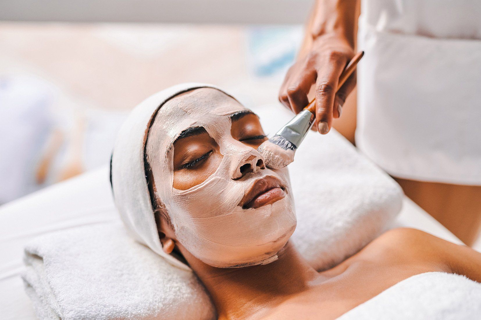 Young woman getting a facial — New Carrollton, MD — Hair Academy