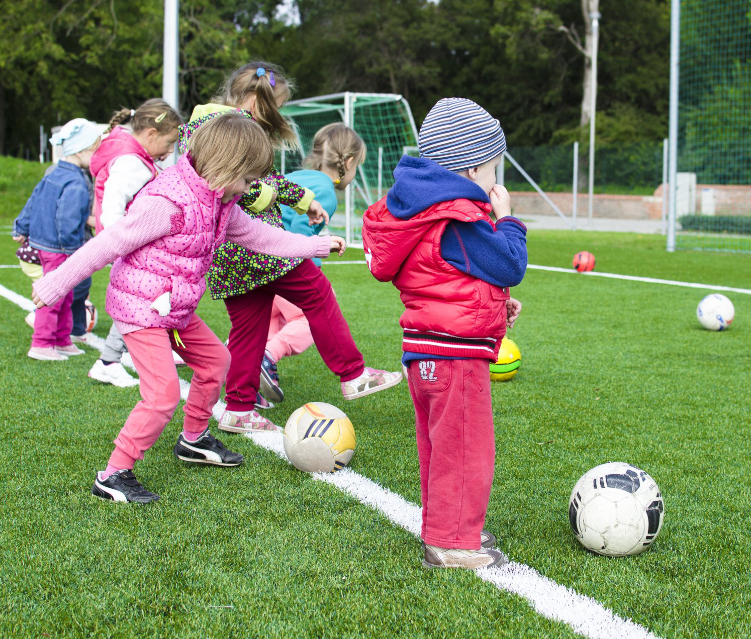 Children kicking balls