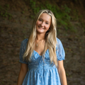 Headshot of a girl smiling.