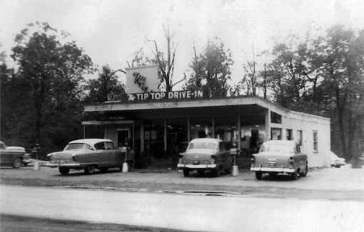 a black and white photo of a tip top drive in