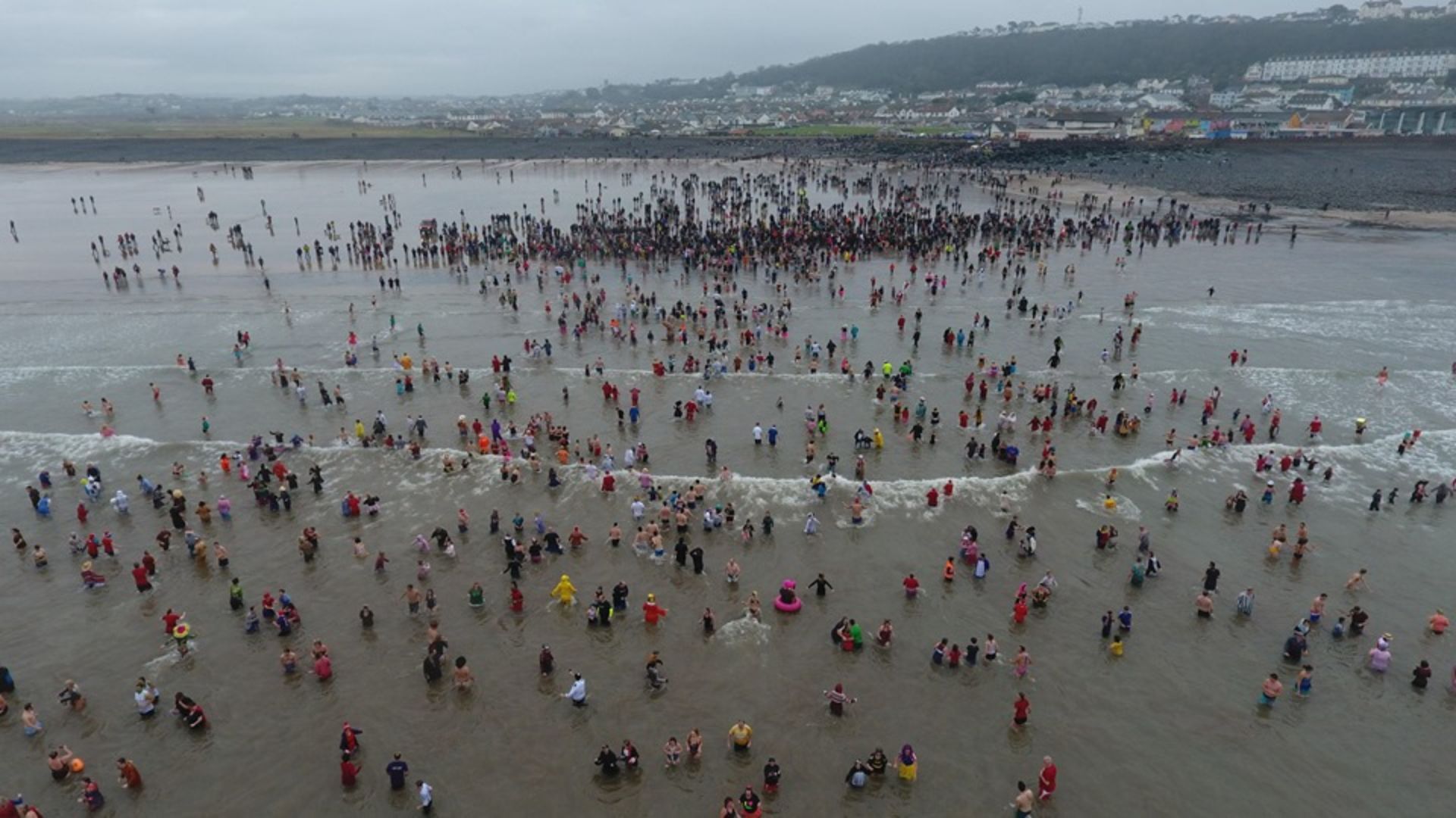 Many people running into the Atlantic Ocean to celebrate the new year. This annual tradition at Westward Ho! draws in many people from around the country. A great free event for Devon.