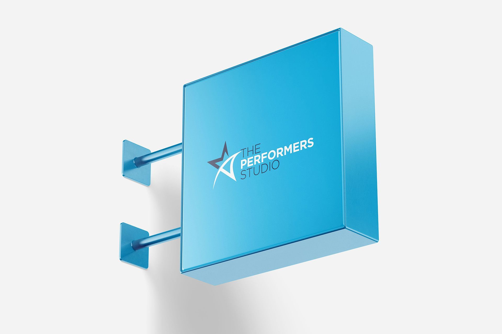Blue, square sign for The Performers Studio, mounted on a wall.