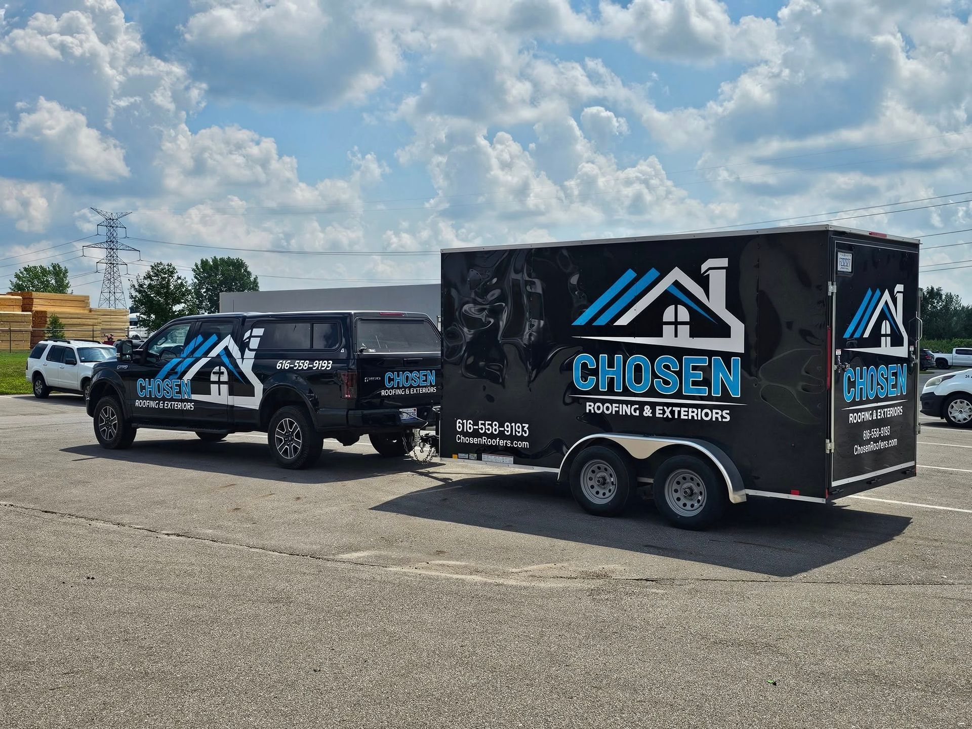 A black pickup truck towing a matching black trailer with 