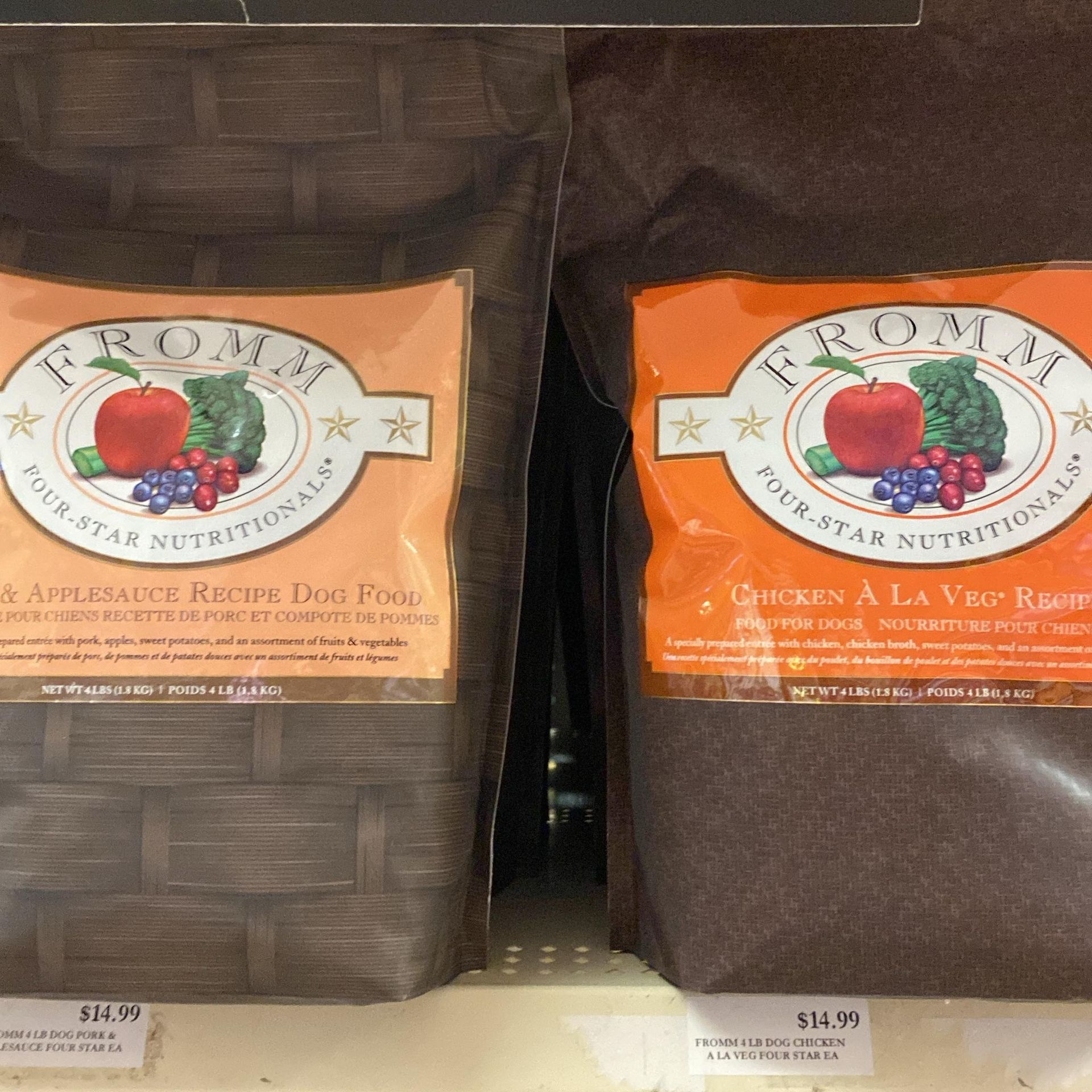 Two bags of fromme dog food are on a shelf