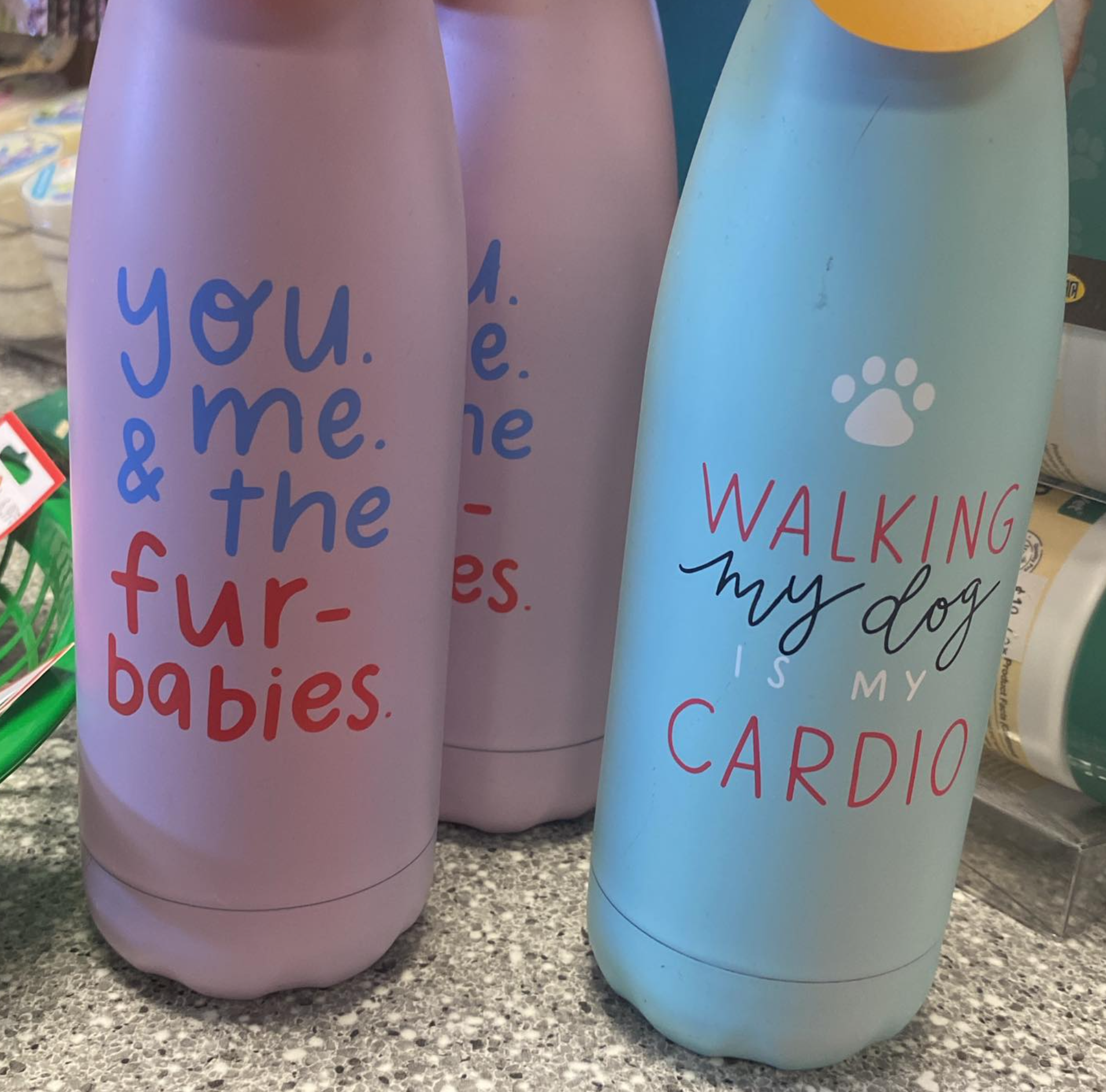A bottle that says walking my dog is my cardio