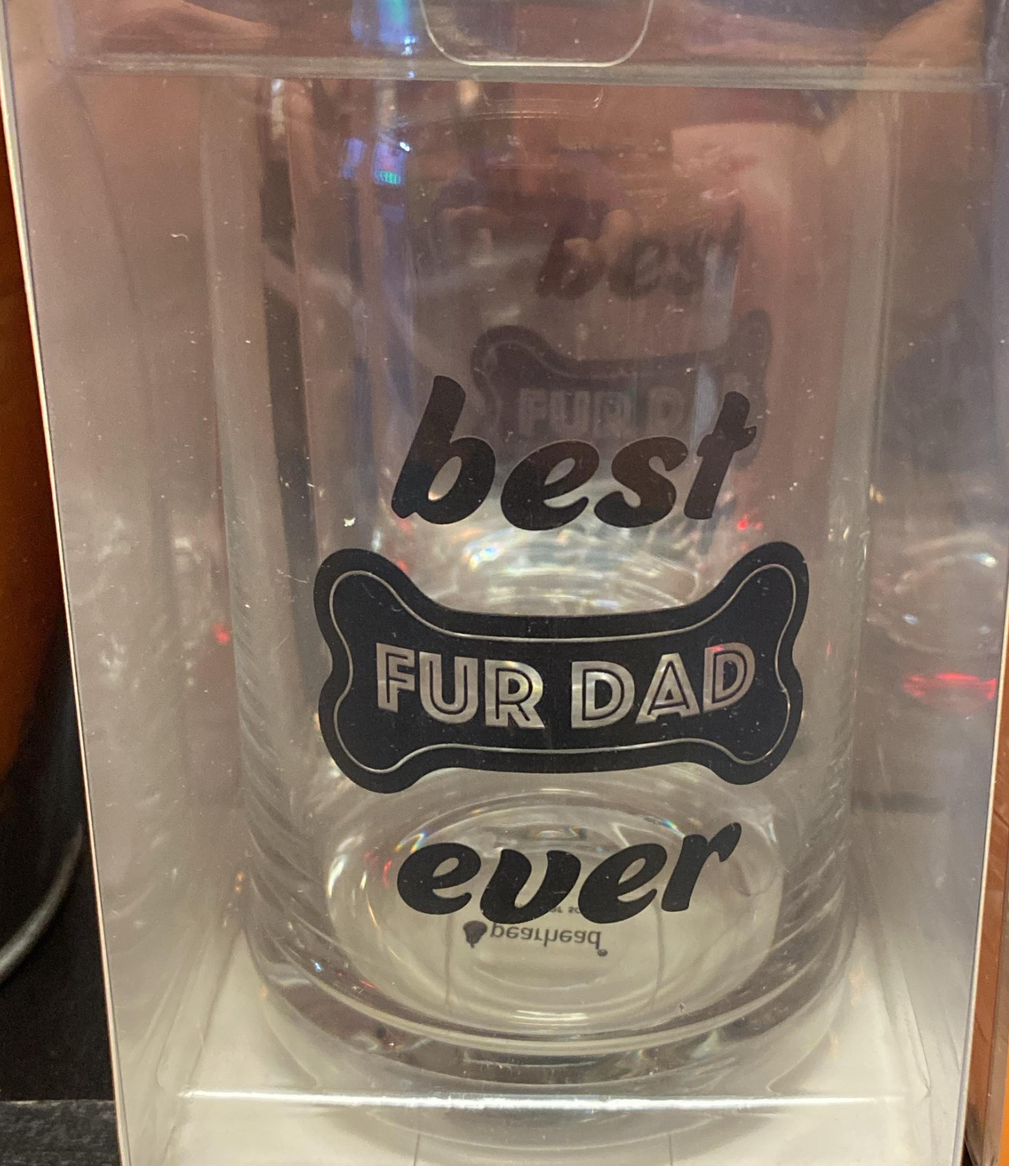 A glass that says best fur dad ever on it