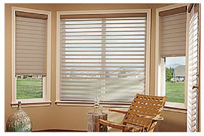 Love is Blinds St. Louis: A living room with a chair and a window with cellular shades.