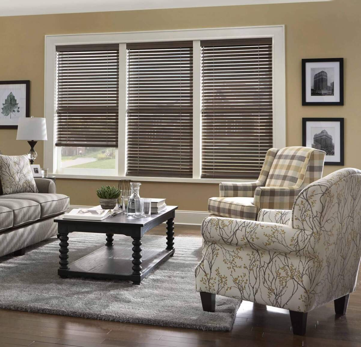 a living room with a couch , chairs , coffee table and horizontal blinds Love is Blinds Missouri (314) 808-3440