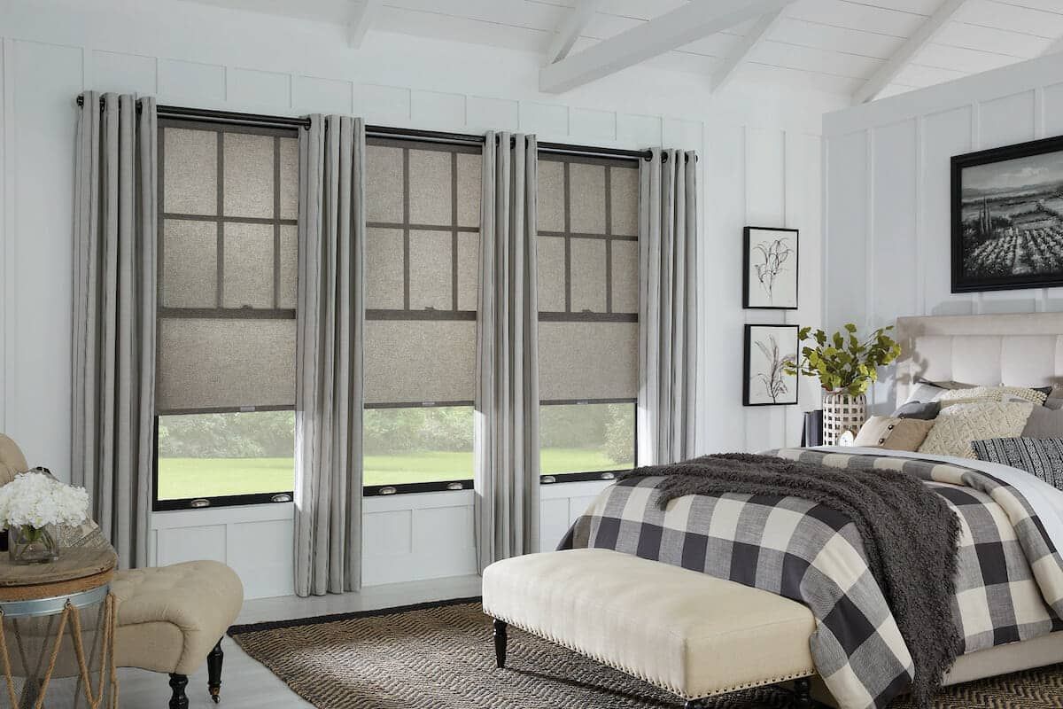 Love is Blinds St. Louis: A living room with a chair and a window with cellular shades.