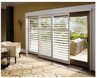 Love is Blinds St. Louis: A living room with sliding glass doors and white shutters